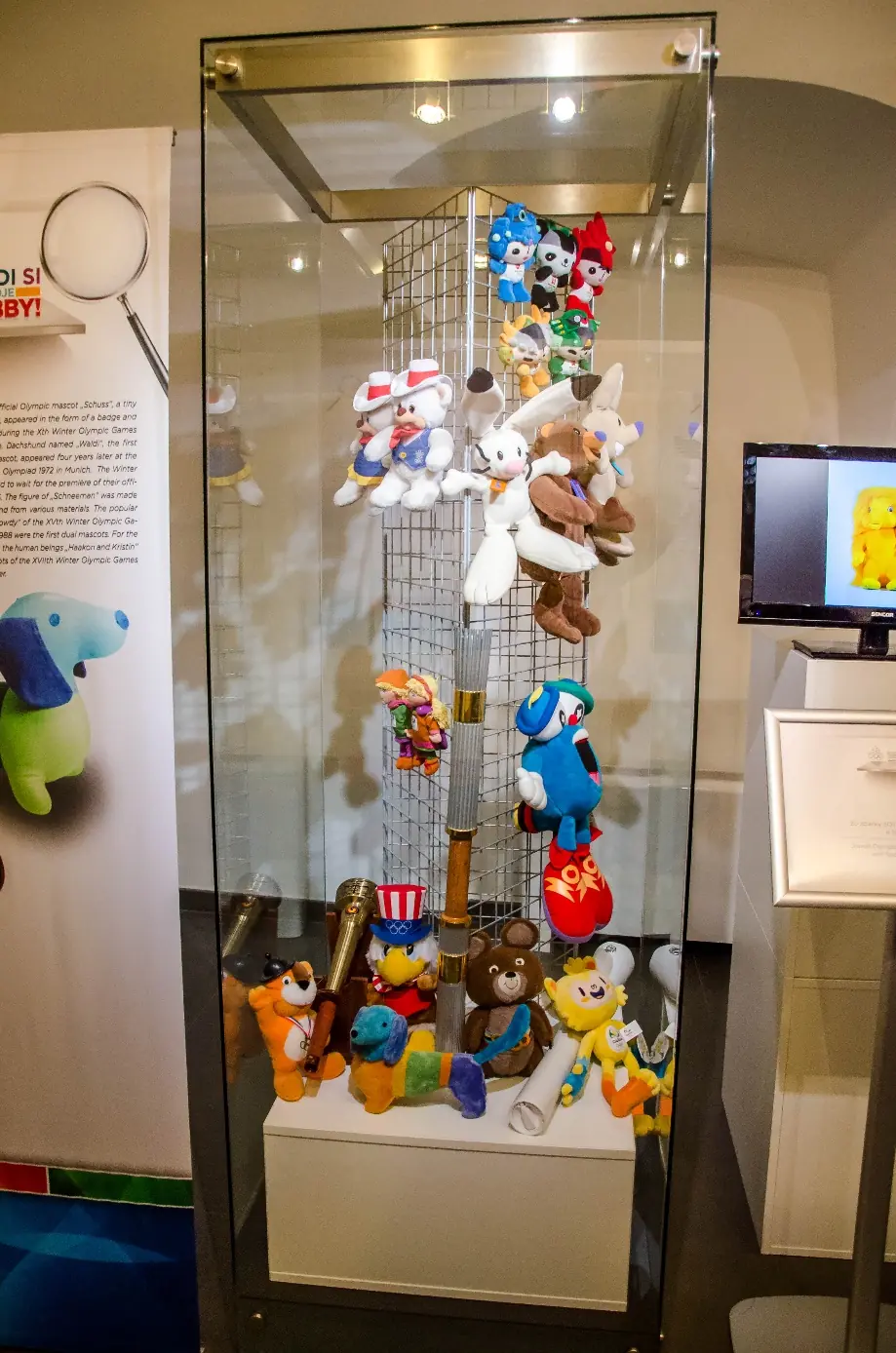 A collection of Olympic mascots and torches
